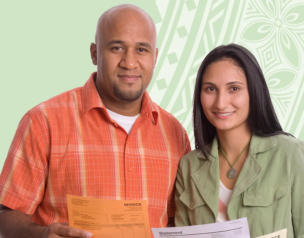 Debt Consolidation Loan - Pacific Finance - Pacific Finance Two smiling adults holding financial documents (an orange invoice and a white statement) in front of a pale green background, likely for billing or proof of payment.